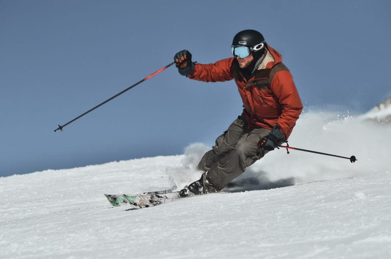 skiing-in-brown-jacket