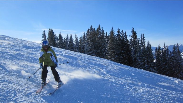 skiing in green jacket