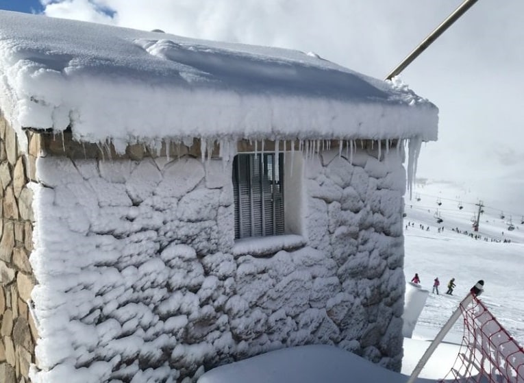 snow blasted building