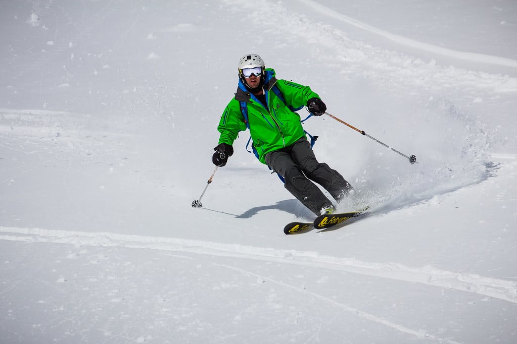 Skier wearing Green Jacket