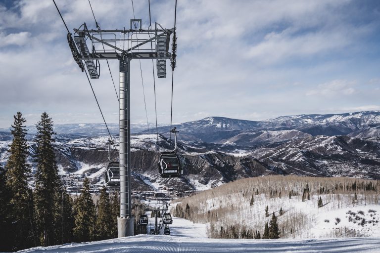 cable cars over snow covered mountain